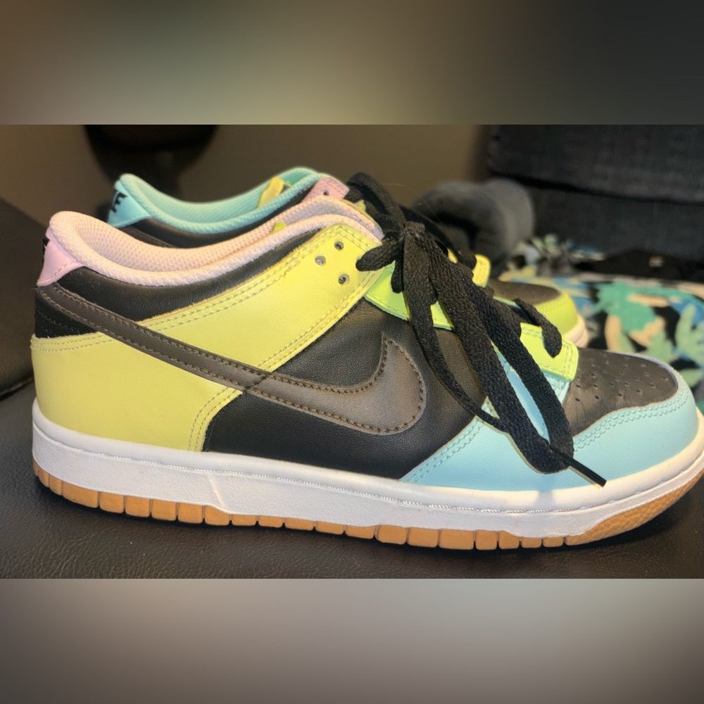 Nike Kids Sneakers in Black, Yellow, Pink, Green, and Blue.
